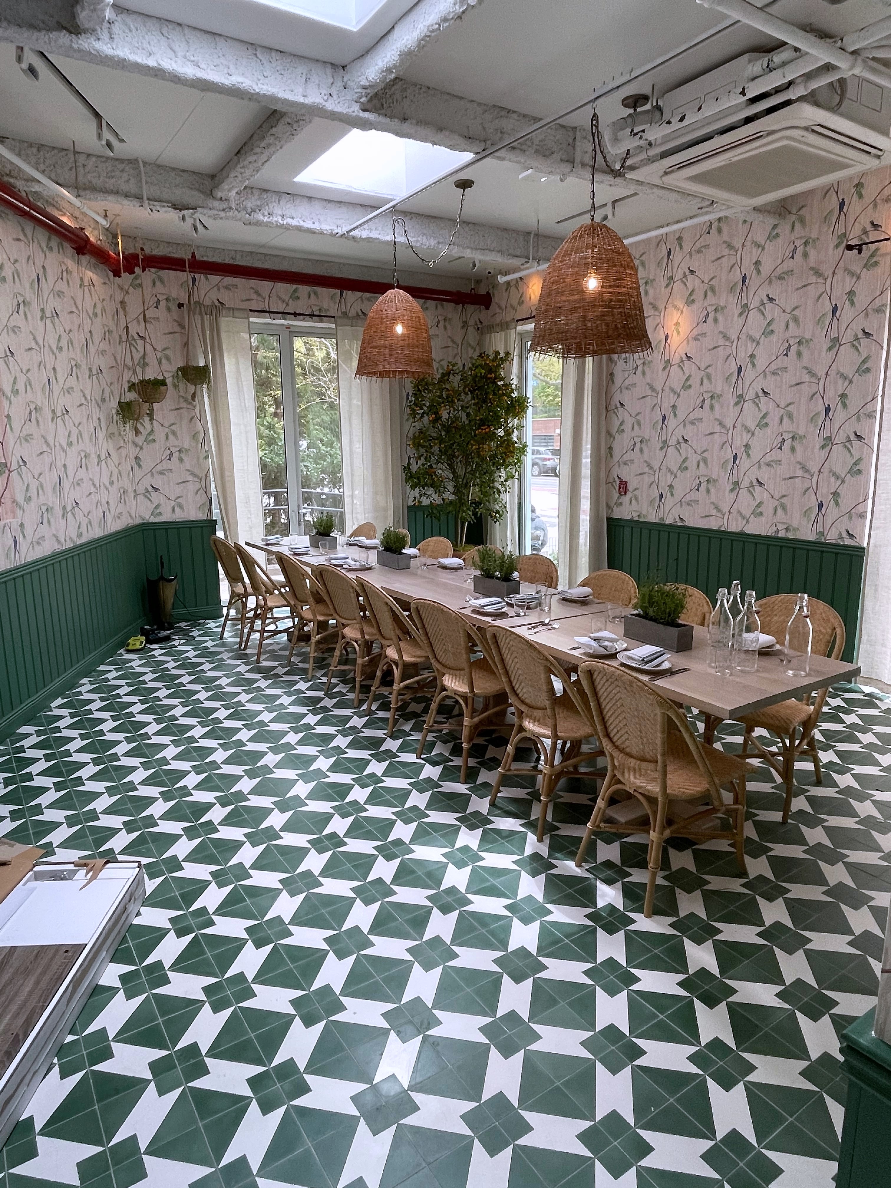 Restaurant private dining room with green tile floor, long table